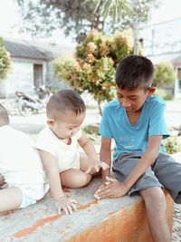 Side view of boy playing in park