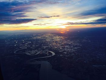 Aerial view of sea against sky at sunset