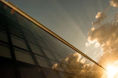 Low angle view of building against sky at sunset