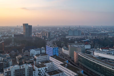 High angle view of city buildings during sunset