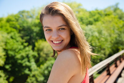 Portrait of smiling teenage girl with brown hair