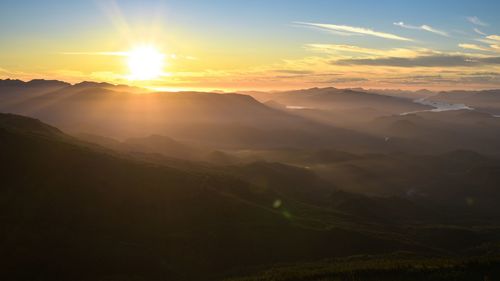 Scenic view of mountains against sky during sunset