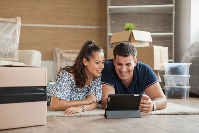 Young woman using laptop at table