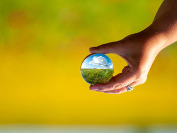 Close-up of human hand holding ball
