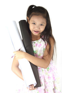 Portrait of a smiling girl holding camera