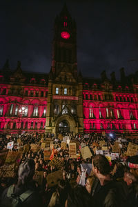 Group of people in front of building at night