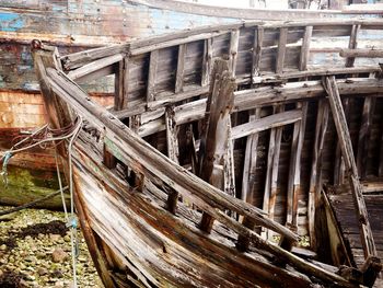 Abandoned boat against building