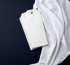 High angle view of white paper on table against black background