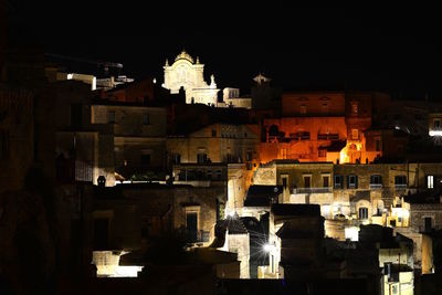 Buildings in city at night