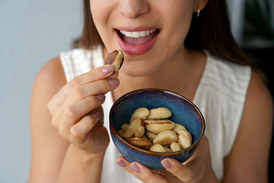 Midsection of woman holding food