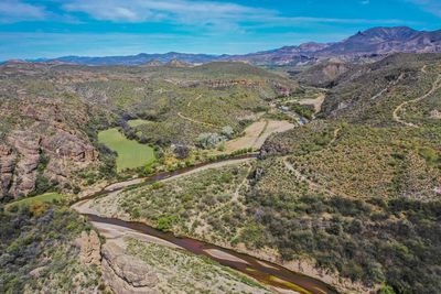 High angle view of road amidst landscape against sky