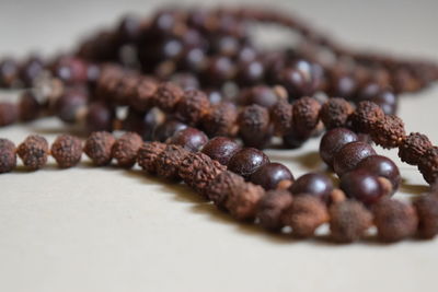 Close-up of rudraksha beads on table