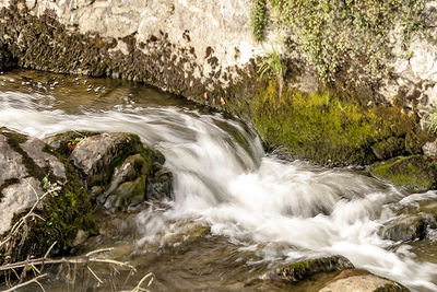 Stream flowing through rocks
