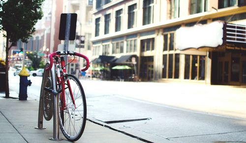 Bicycle locked on rack at street