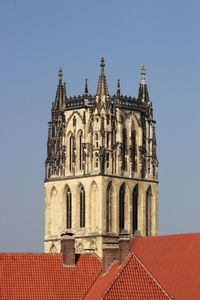 Cathedral tower above the rooftop