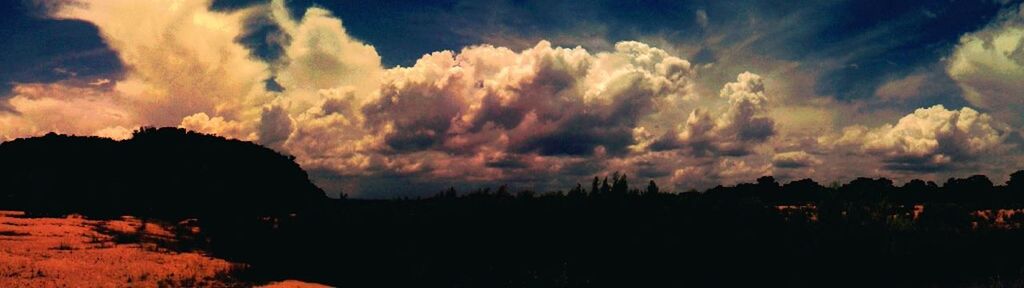 sky, sunset, silhouette, tranquil scene, scenics, tranquility, beauty in nature, cloud - sky, landscape, nature, dramatic sky, cloud, idyllic, cloudy, dusk, orange color, atmospheric mood, outdoors, moody sky, non-urban scene