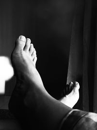 Low section of woman relaxing on floor