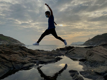 Jumping man during sunset