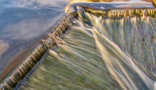 High angle view of water flowing over sea