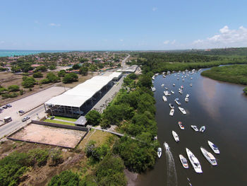 High angle view of river amidst trees against sky