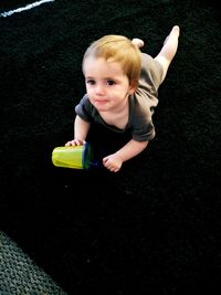 Portrait of cute boy playing with toy