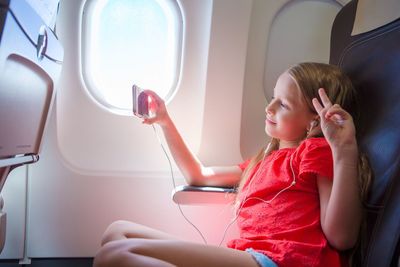 Girl sitting in airplane