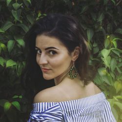 Close-up portrait of young woman standing outdoors