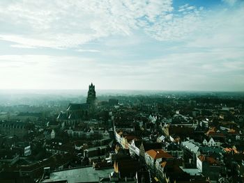 High angle view of city against cloudy sky