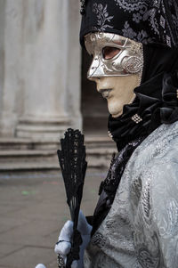 Side view of person wearing mask and costume
