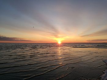 Scenic view of sea against sky at sunset