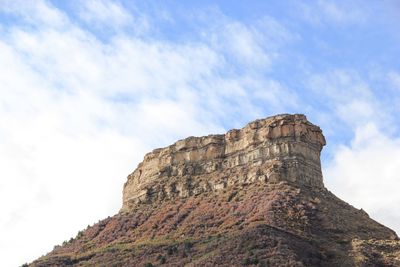 Low angle view of rocky mountain at mesa verde national park against sky