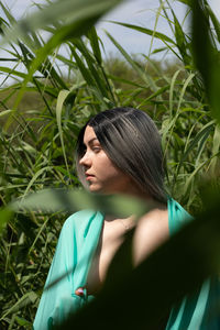 Portrait of young woman looking away