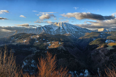 Scenic view of snowcapped mountains against sky