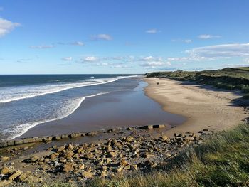 Scenic view of beach against sky