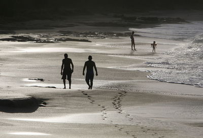 Silhouette of people on beach