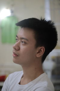 Portrait of young man looking away