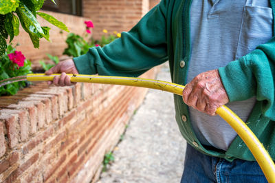 Midsection of man working in workshop