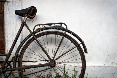 Bicycle wheel against wall