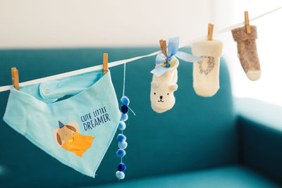 Close-up of clothespins hanging on table
