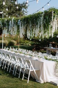 Empty chairs and tables in park