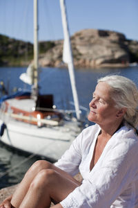 Senior woman relaxing at water