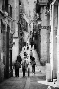 People walking on street in city