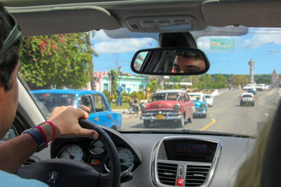 Cropped image of car on road