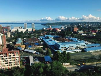 High angle view of buildings and trees against sky