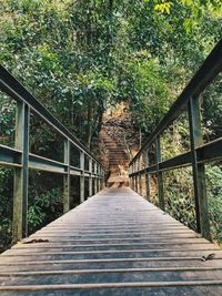 Rear view of woman on footbridge