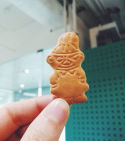 Close-up of hand holding ice cream cone