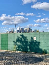 Buildings in city against sky