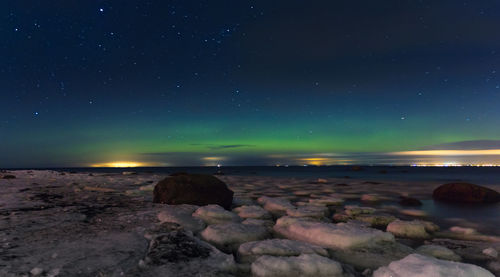 Scenic view of sea against sky at night