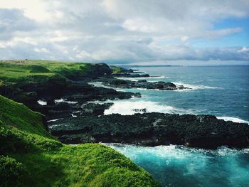 Scenic view of sea against cloudy sky