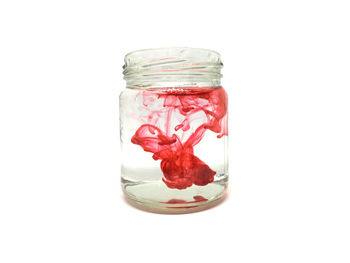 Close-up of jar against white background